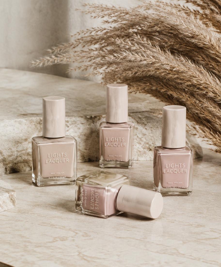 Beige and blush nail polish bottles